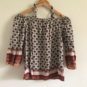 Cold-shoulder floral shirt.